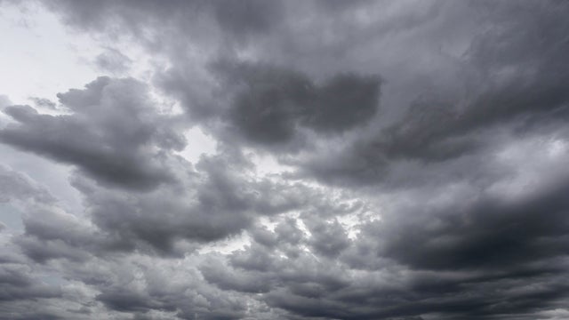 Full frame of a low angle shot of a gray sky with clouds of rain. 