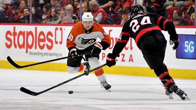Dylan Cozens #24 of the Ottawa Senators defends against Bobby Brink #10 of the Philadelphia Flyers as he carries the puck during the first period at Canadian Tire Centre on April 13, 2025 in Ottawa. 